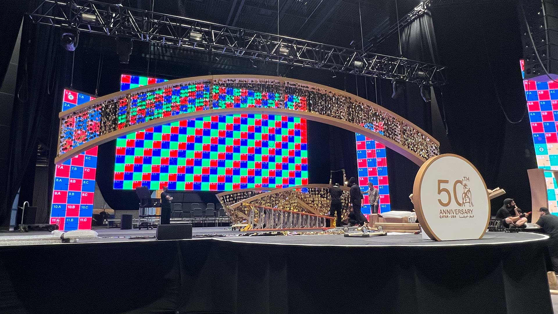 Stage arch from audience perspective, 60-foot golden arch, Qatar-USA 50th Anniversary Gala, The Anthem DC