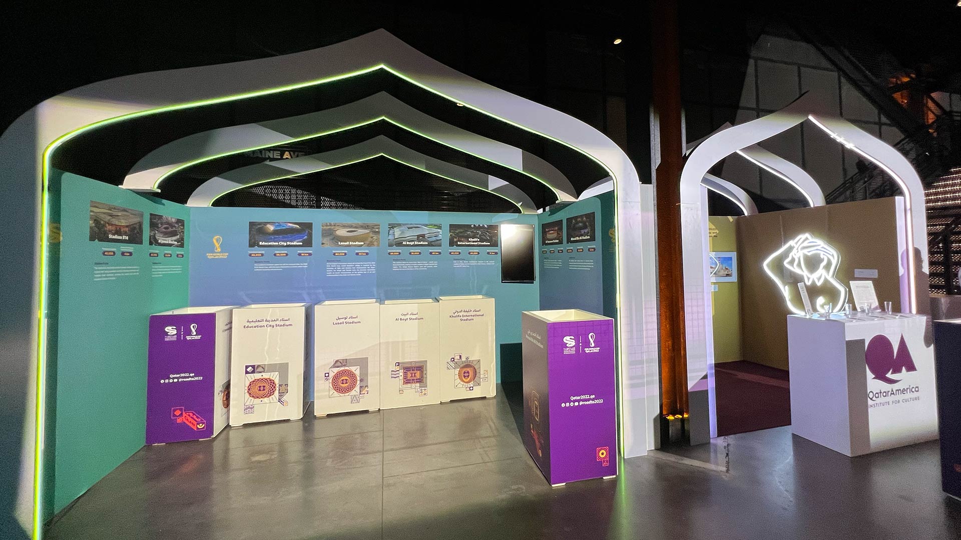 Full room view, Qatar-USA 50th Anniversary Gala, golden stage arch and exhibit booths, The Anthem DC, EventPro