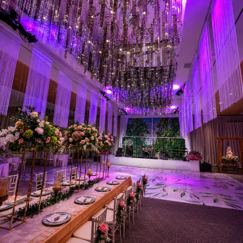 Wedding lighting with a suspended fairy light ceiling and uplit drape at the Conrad Washington, DC by EventPro