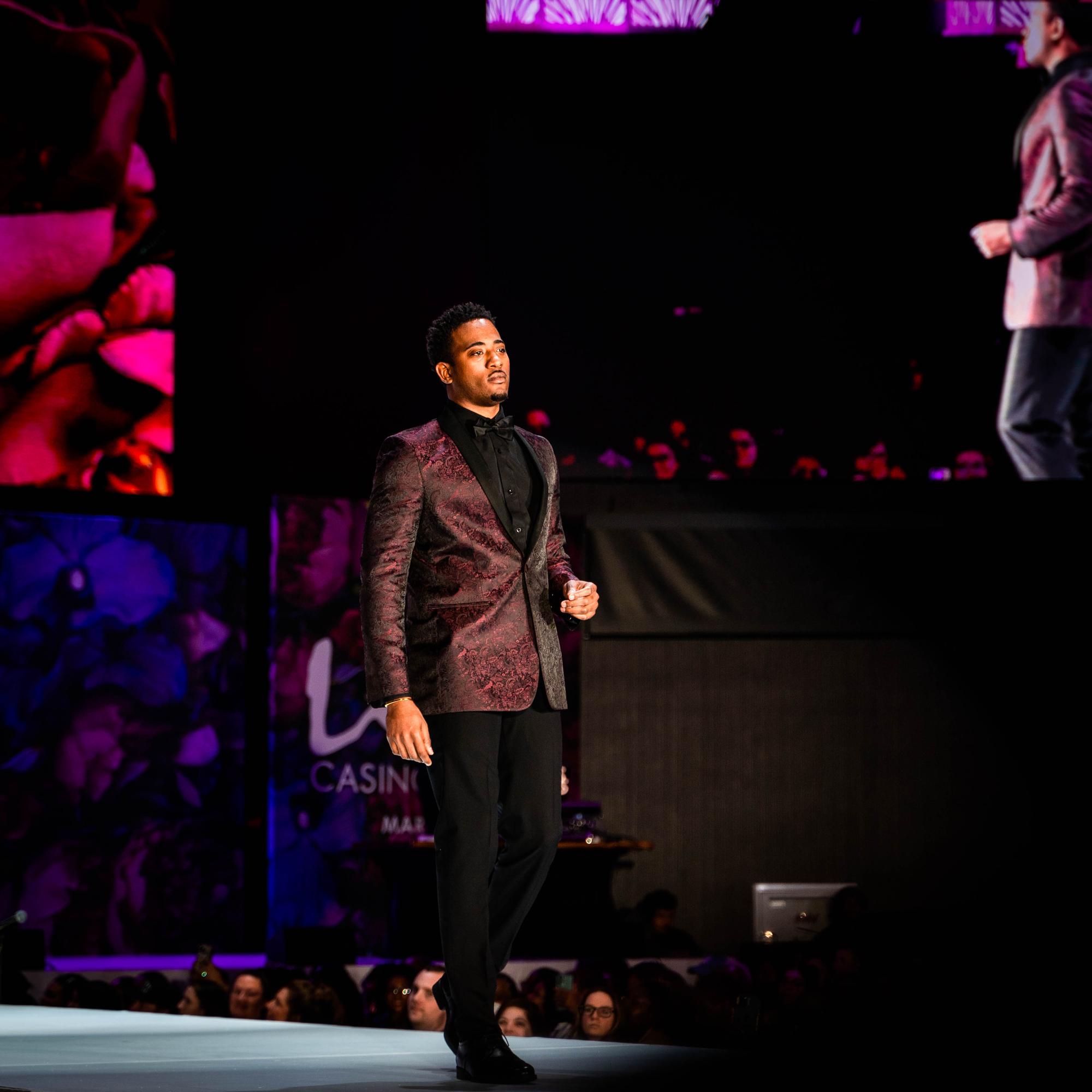 Male model in burgundy jacquard tuxedo on the runway, Randy Fenoli Wedding Showcase, Live! Casino & Hotel Maryland, EventPro production