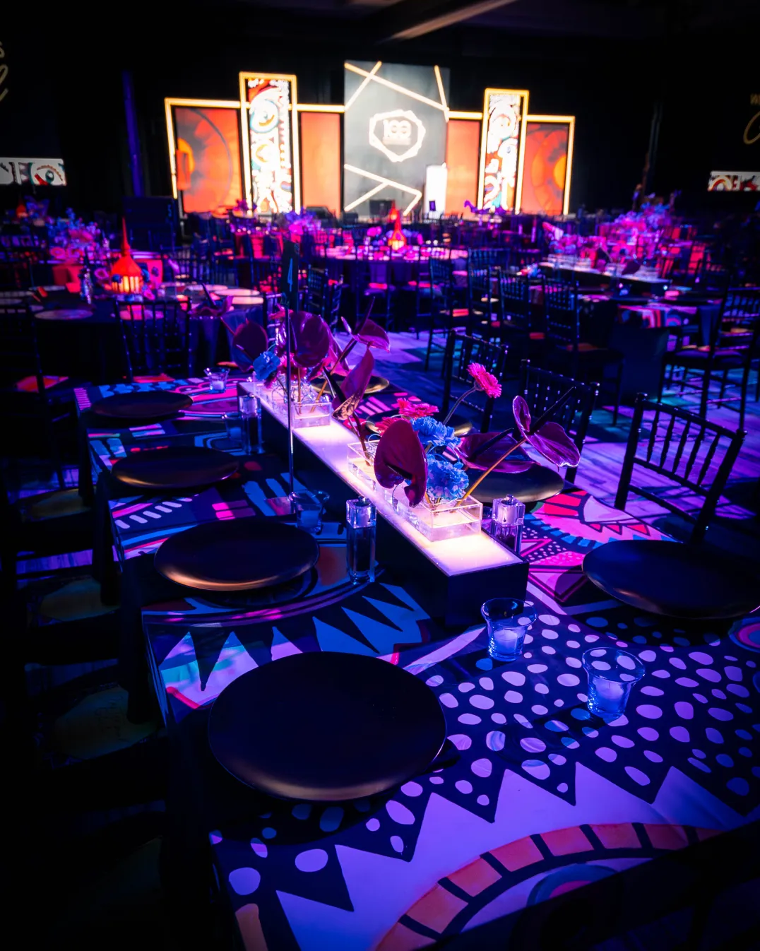 Custom-printed geometric tablecloths and illuminated acrylic floral runners, Wilmer Eye Institute Centennial Gala, EventPro graphics and print production, Baltimore