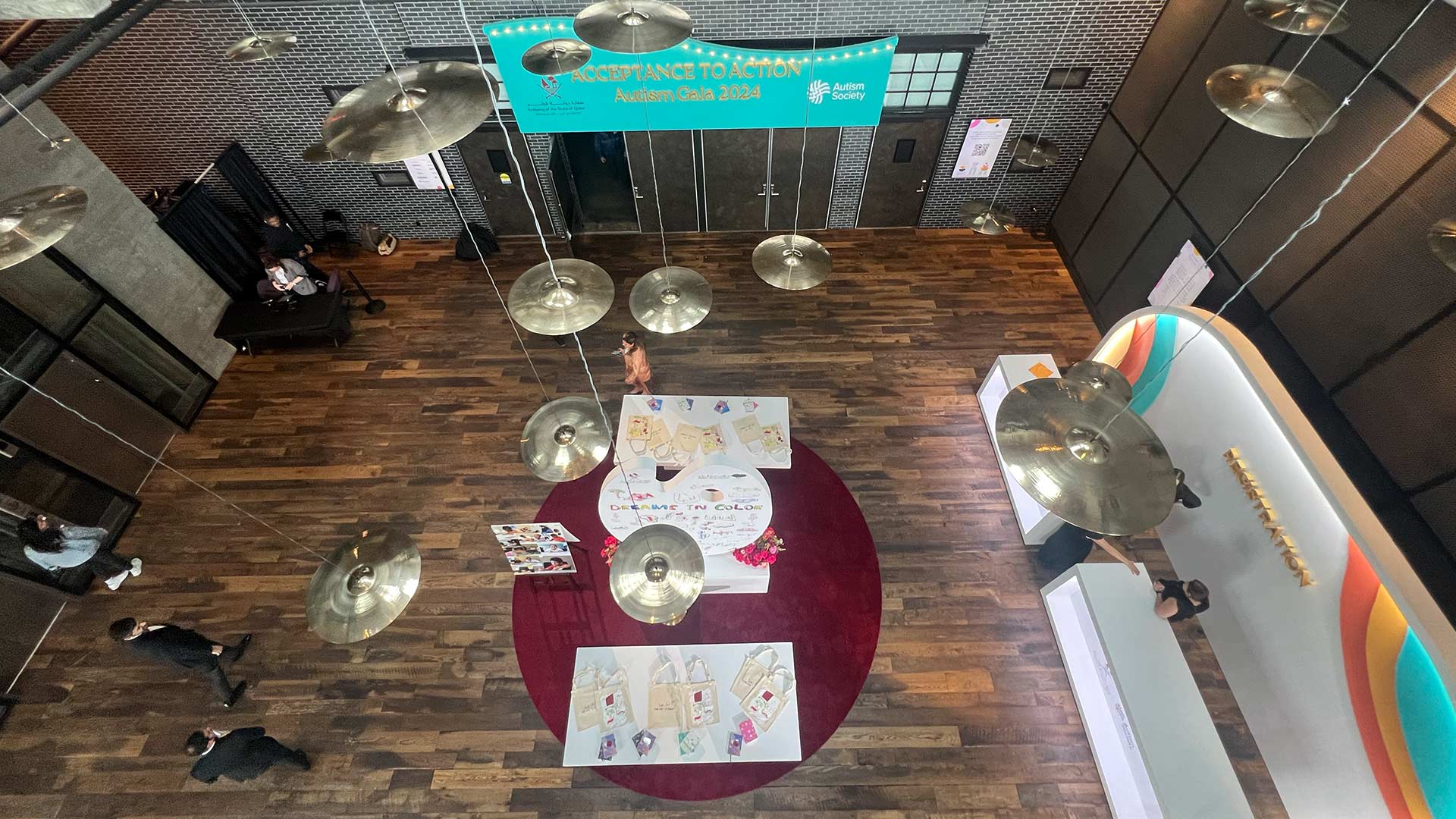 Connect Accept Empower foyer art installations — three custom sculptural pieces in event color palette, dimensional gold letters on perforated metal wall, EventPro Washington DC