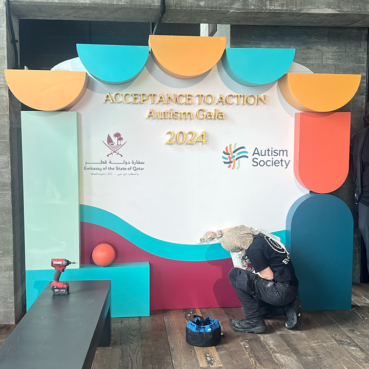 Acceptance to Action Autism Gala 2024 photo op — CNC-fabricated angled frame with event branding, geometric sculptural elements in event color palette