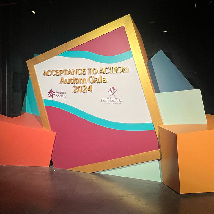 Gala stage from audience perspective — LED video wall, CNC stage scenic surround, colorful geometric shapes, The Anthem DC EventPro