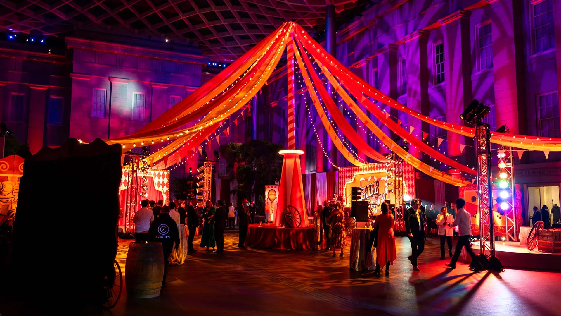 Circus themed gala big top tent draping with evening crowd — EventPro event production