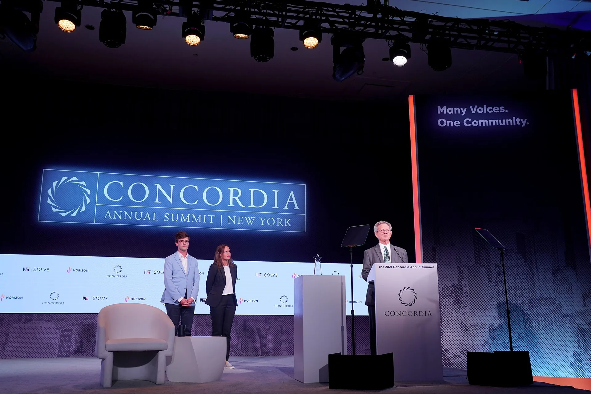 Full stage wide at Concordia Annual Summit 2021, presenter at Concordia lectern, MIT Solve and Horizon sponsor step-and-repeat, EventPro stage construction and graphics, Sheraton Times Square New York