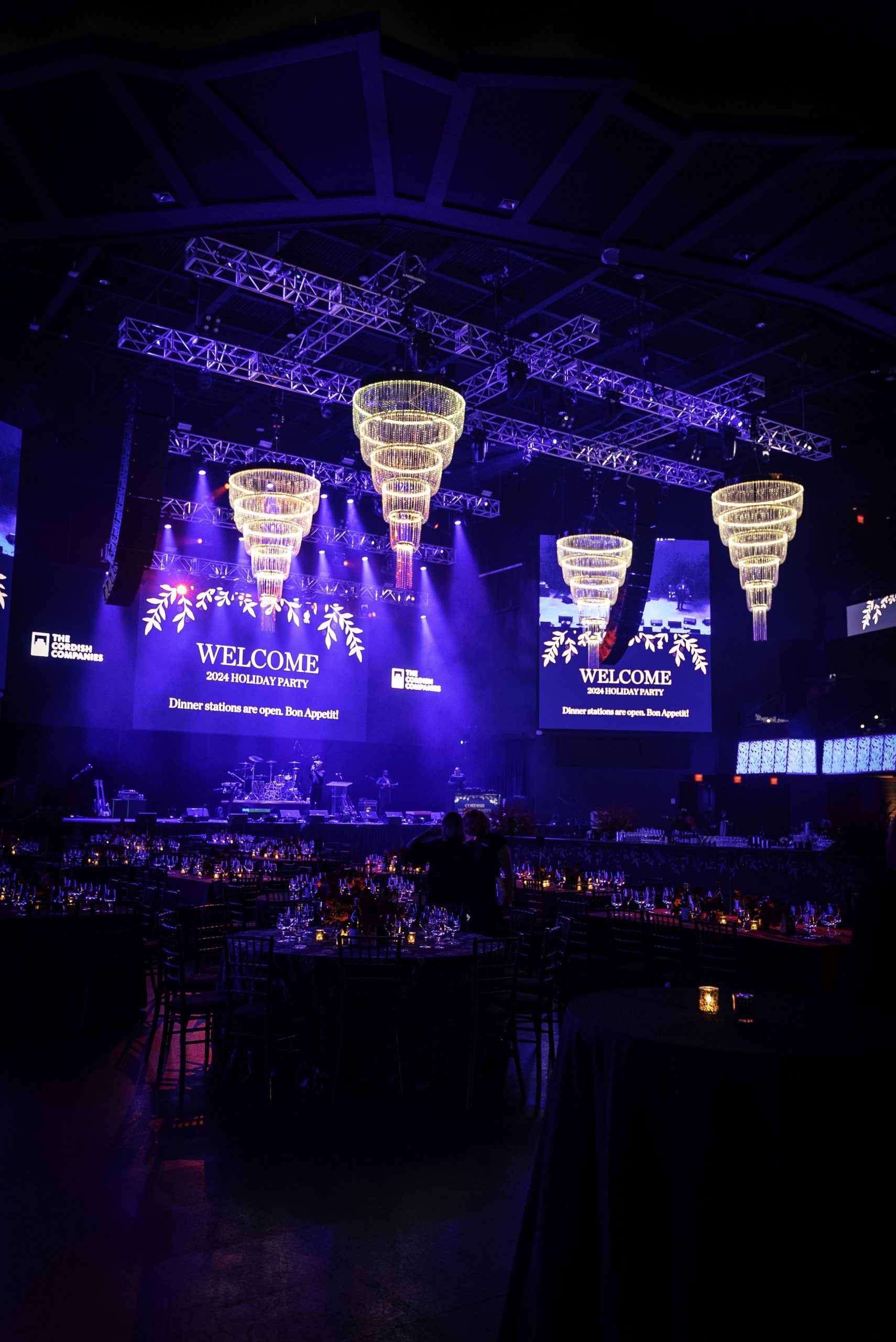 Looking up through production truss at tiered crystal chandeliers rigged for the Cordish Companies holiday party, EventPro rigging, Maryland