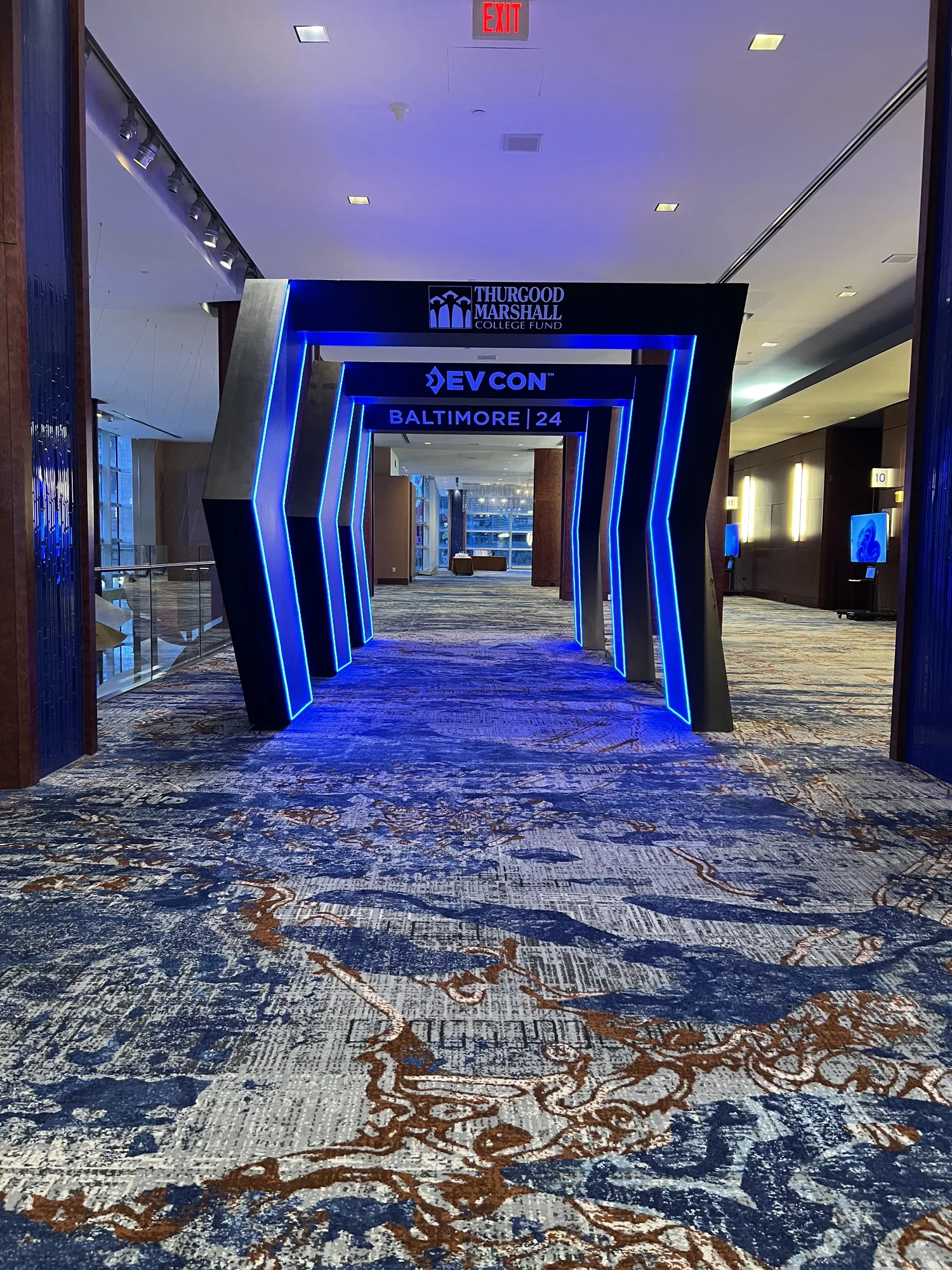 Illuminated DevCon entrance arch portal viewed from inside the corridor, DevCon Conference 2024, Hilton Baltimore, EventPro fabrication