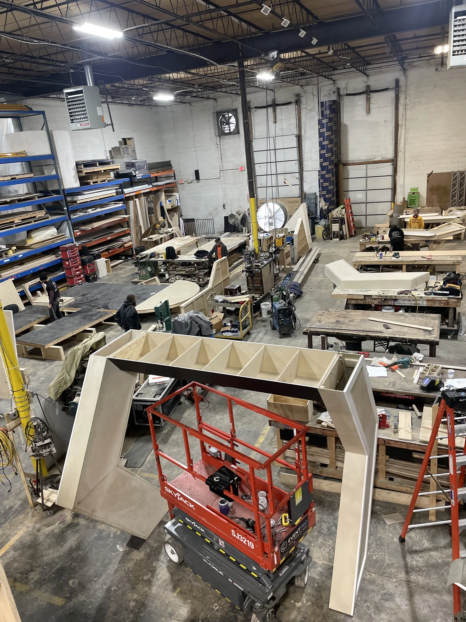 EventPro shop build overhead showing stage components and scenic elements under construction for DevCon 2024, Maryland fabrication
