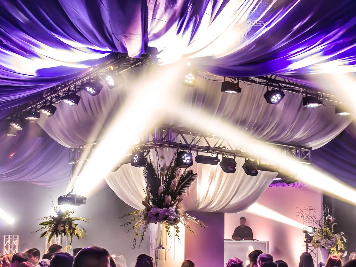 Overhead beam effects from intelligent moving head lighting rig at event by Event Pro