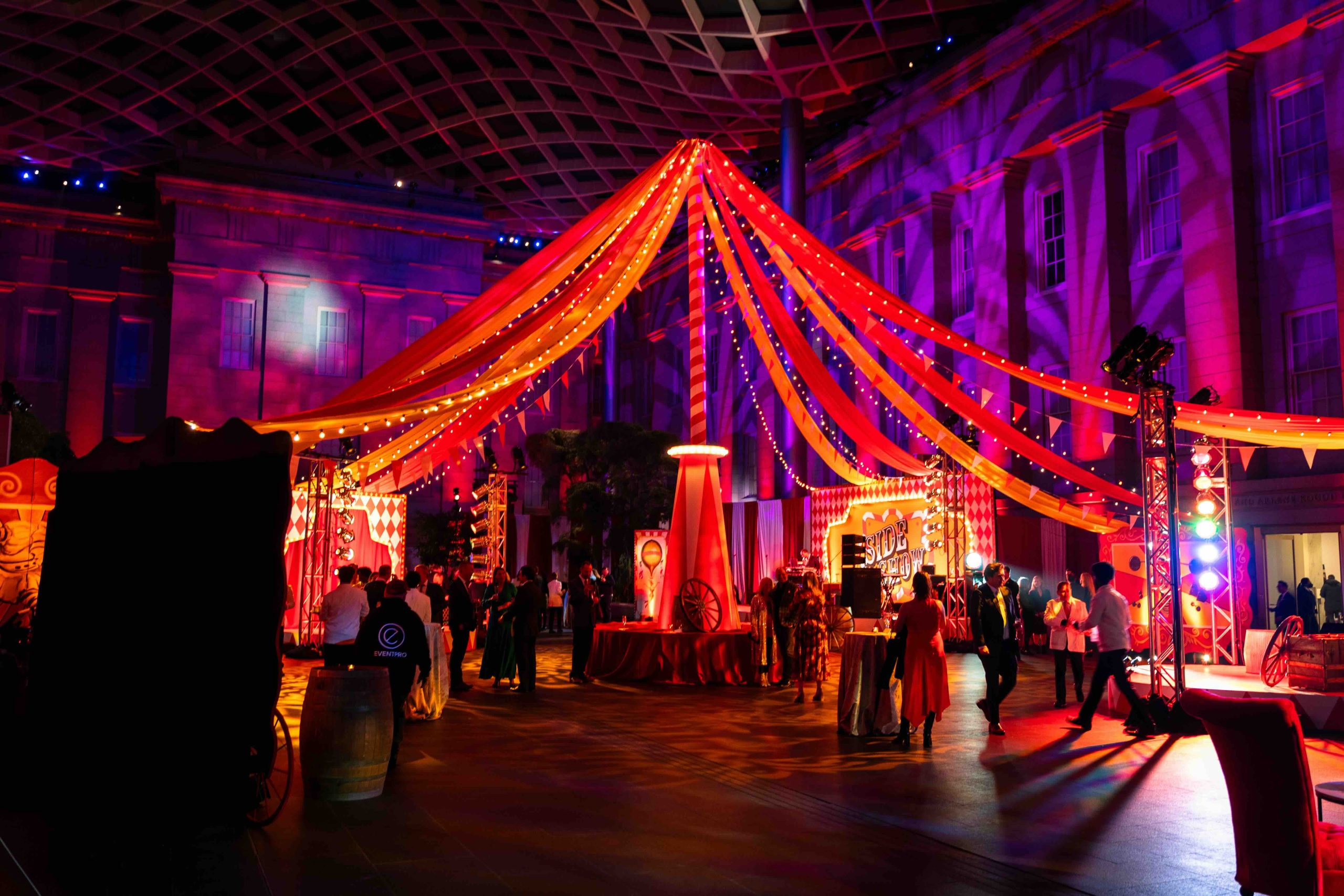 500 guests under the custom fabric tent canopy in the National Portrait Gallery Atrium, Kings Dinner DC Mardi Gras 2025, full-scale circus environment by EventPro Washington DC