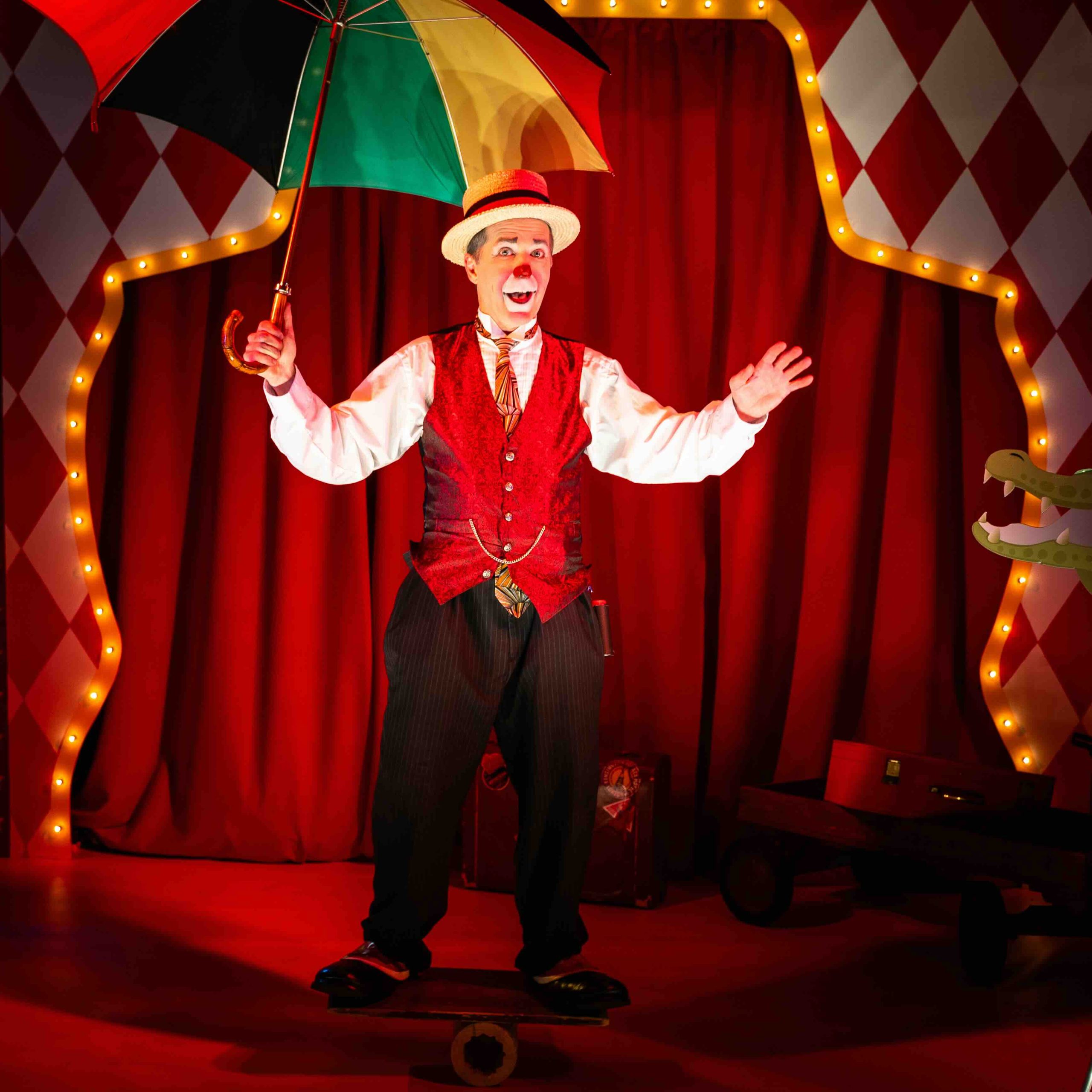 Circus clown performer in front of custom-fabricated marquee arch with harlequin backdrop, Kings Dinner DC Mardi Gras 2025, EventPro Washington DC