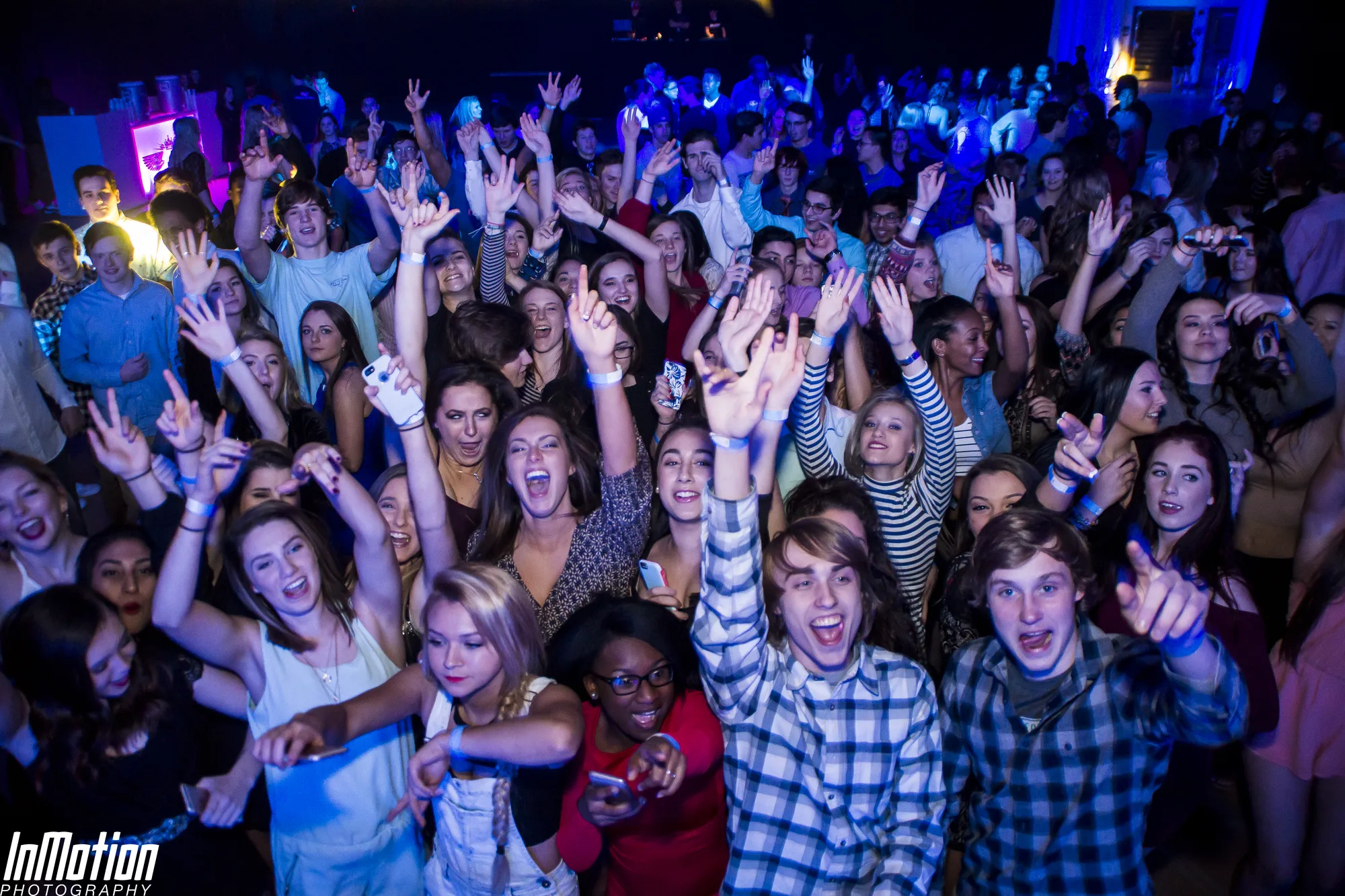 Crowd with hands raised at peak energy moment, Lights Out concert APGFCU Arena Maryland, EventPro concert production and lighting