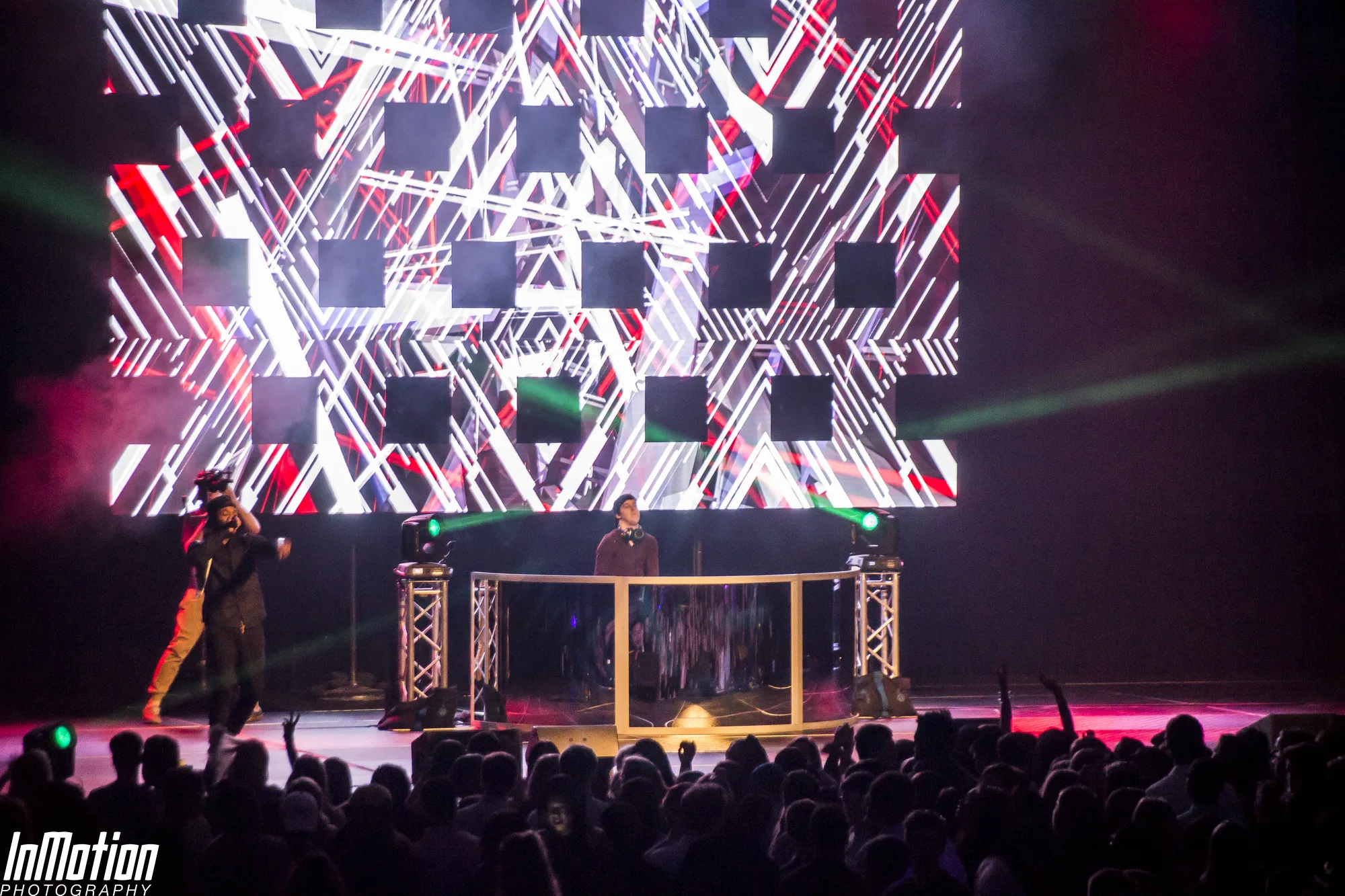 Lights Out concert at APGFCU Arena, performers on stage with bold red and white LED video wall, moving head lighting rig, EventPro concert production Maryland