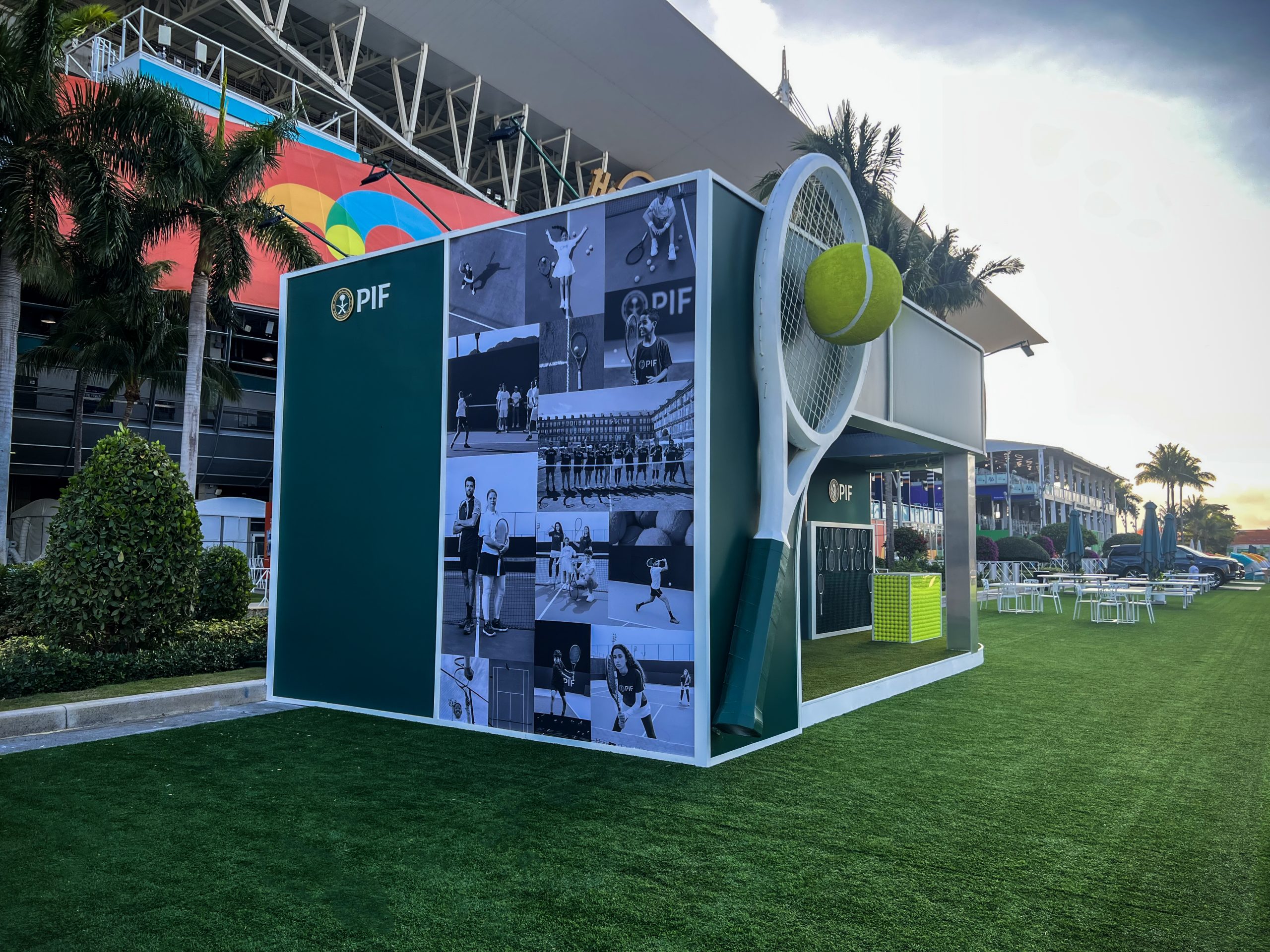 PIF companion display structure, large-format black-and-white tennis photo collage wall with oversized fabricated racket sculpture at the 2025 Miami Open, Miami Gardens Florida