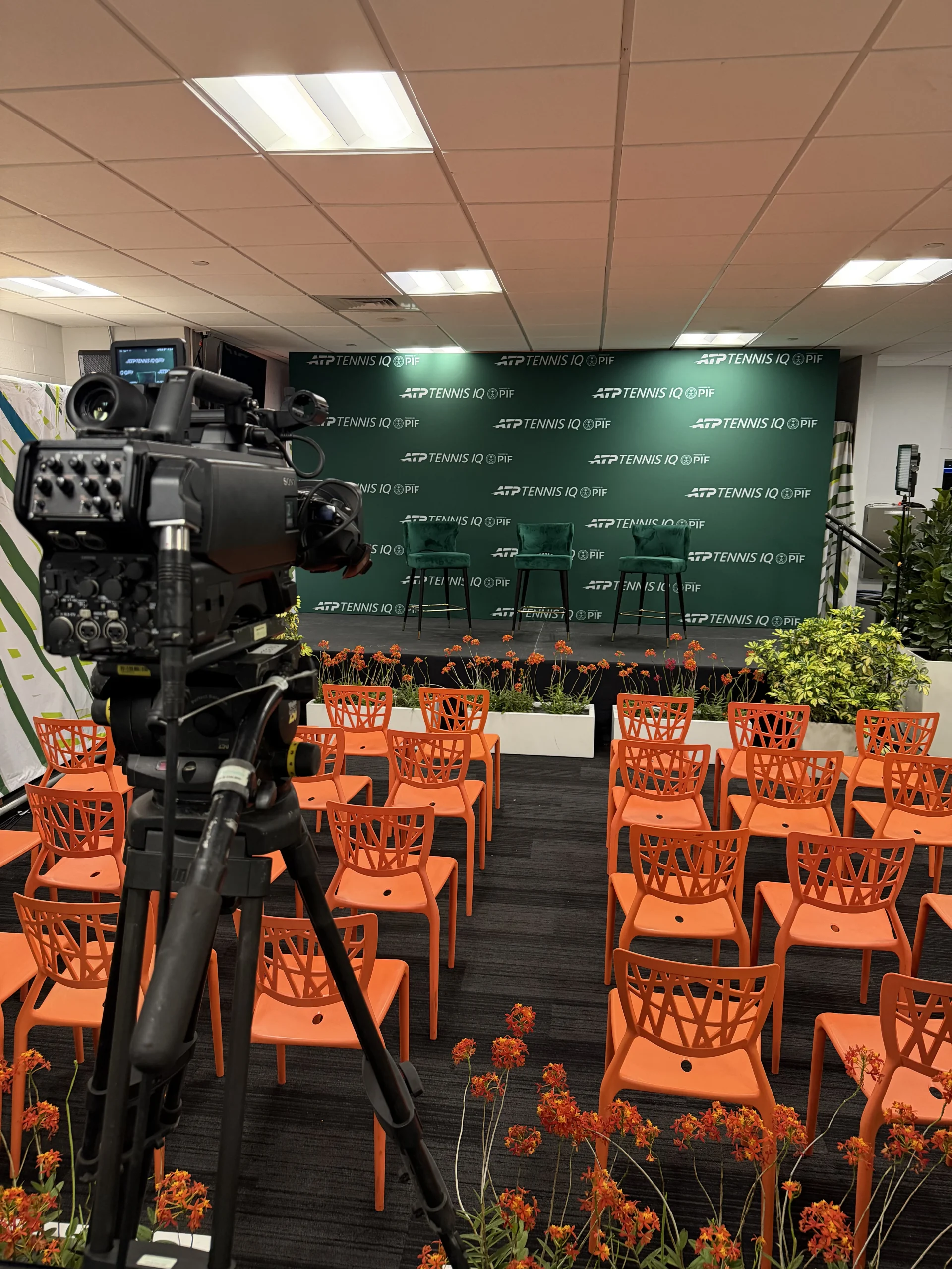Broadcast camera positioned in front of ATP Tennis IQ PIF branded press conference room, EventPro Miami Open 2026