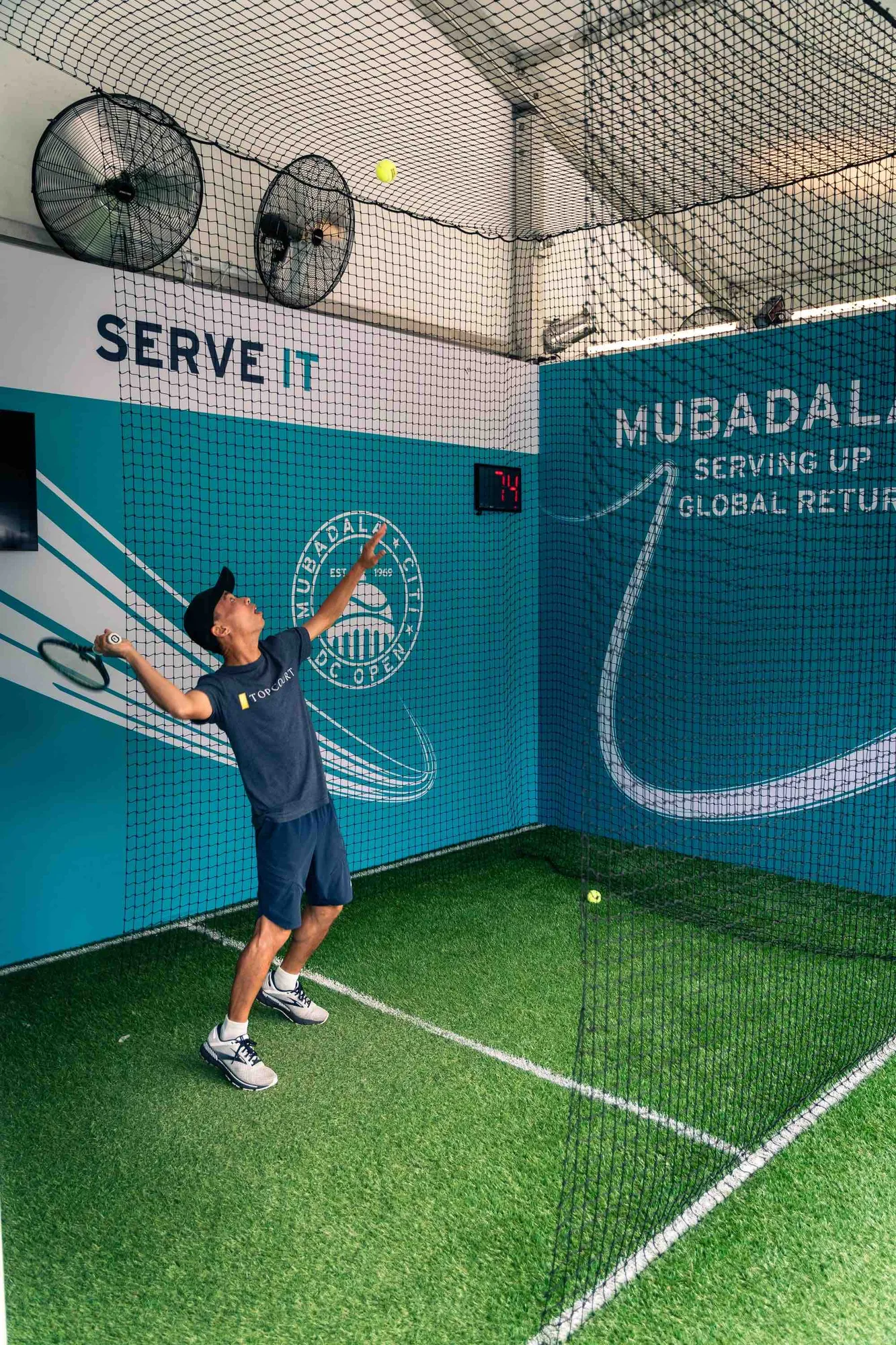 Serve It speed radar wall, kid serving a tennis ball at Mubadala activation, Citi DC Open 2023, EventPro