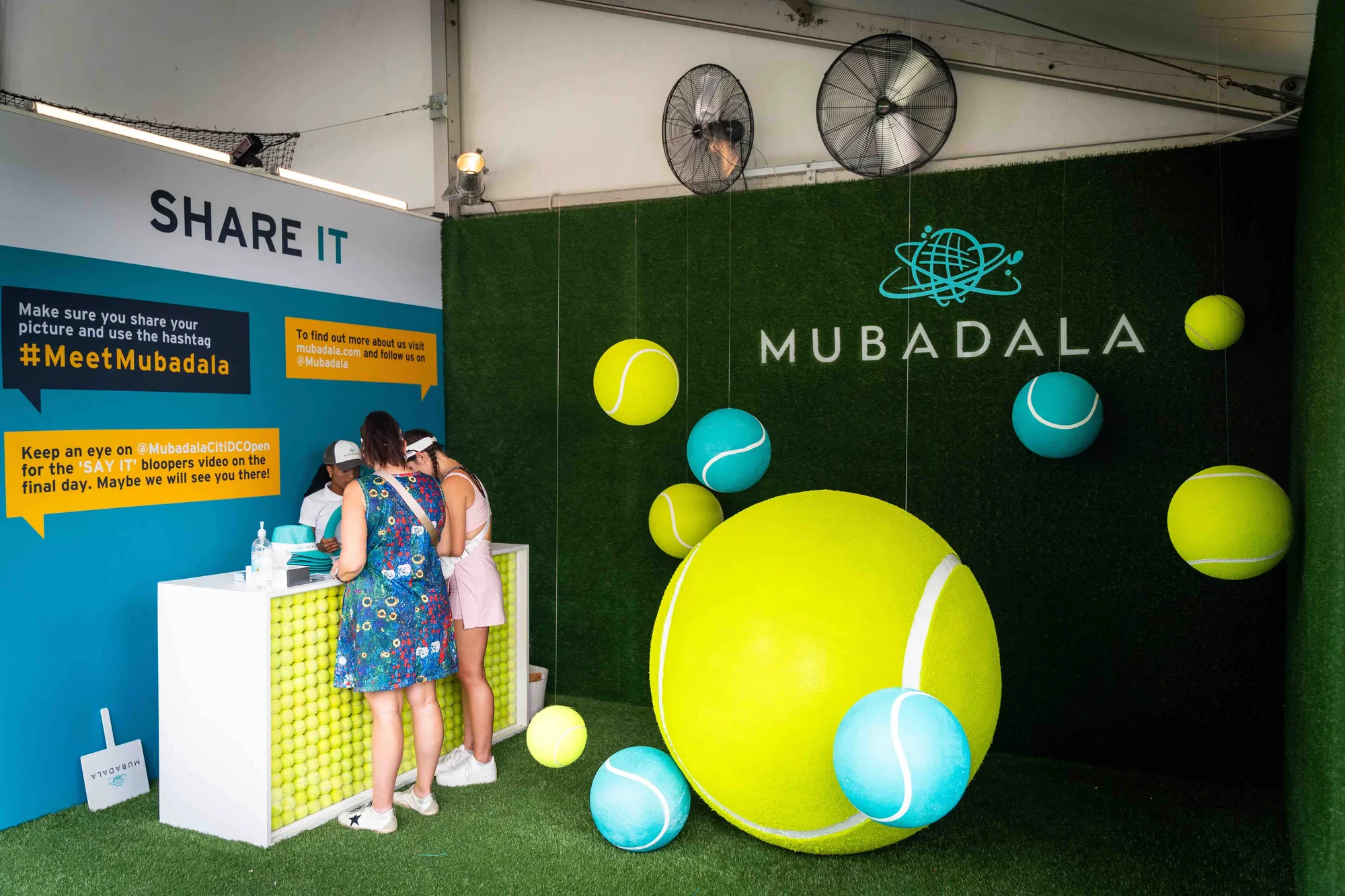 Mubadala Share It activation with giant tennis ball installation and branded logo wall, Citi DC Open 2023, Fitzgerald Tennis Center, EventPro