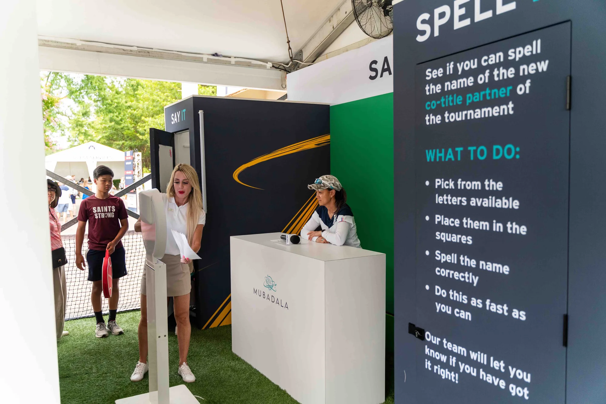 Visitor at the Spell It interactive game zone inside Mubadala brand activation tent, Citi DC Open 2023, EventPro
