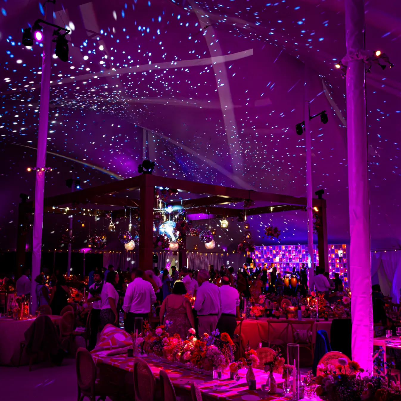 Outdoor wedding tent reception with starfield lighting effect and purple wash — EventPro productions