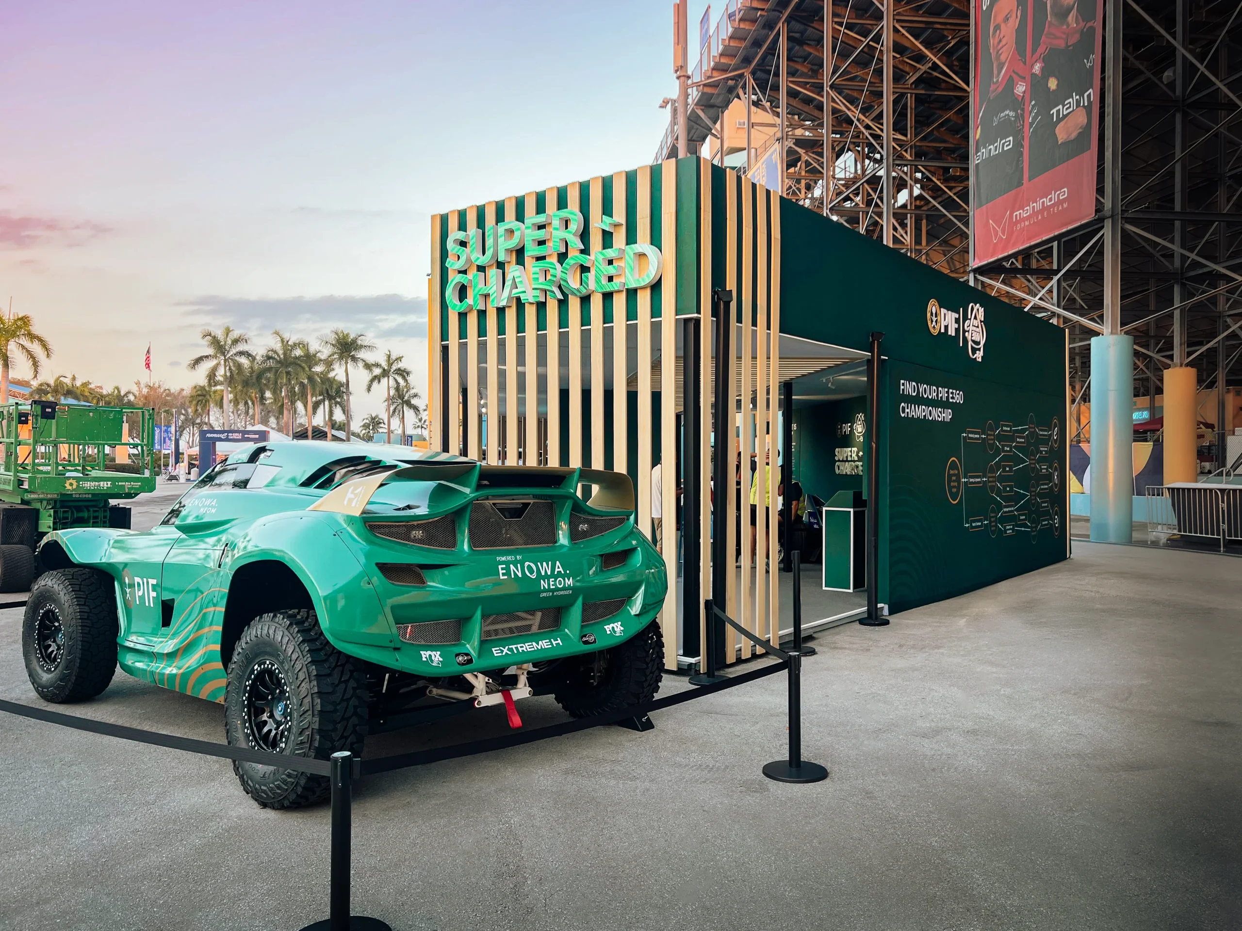 PIF Super Charged activation pavilion at golden hour with Extreme H truck — Formula E Miami ePrix 2025, EventPro