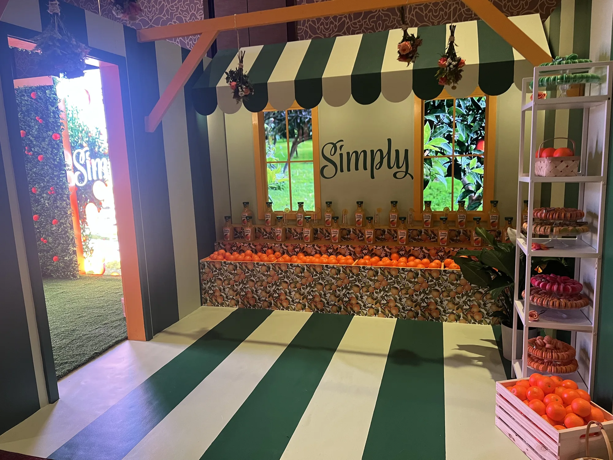 Simply brand activation market stall interior with green awning and product counter — Hard Rock Hotel Miami Gardens, EventPro
