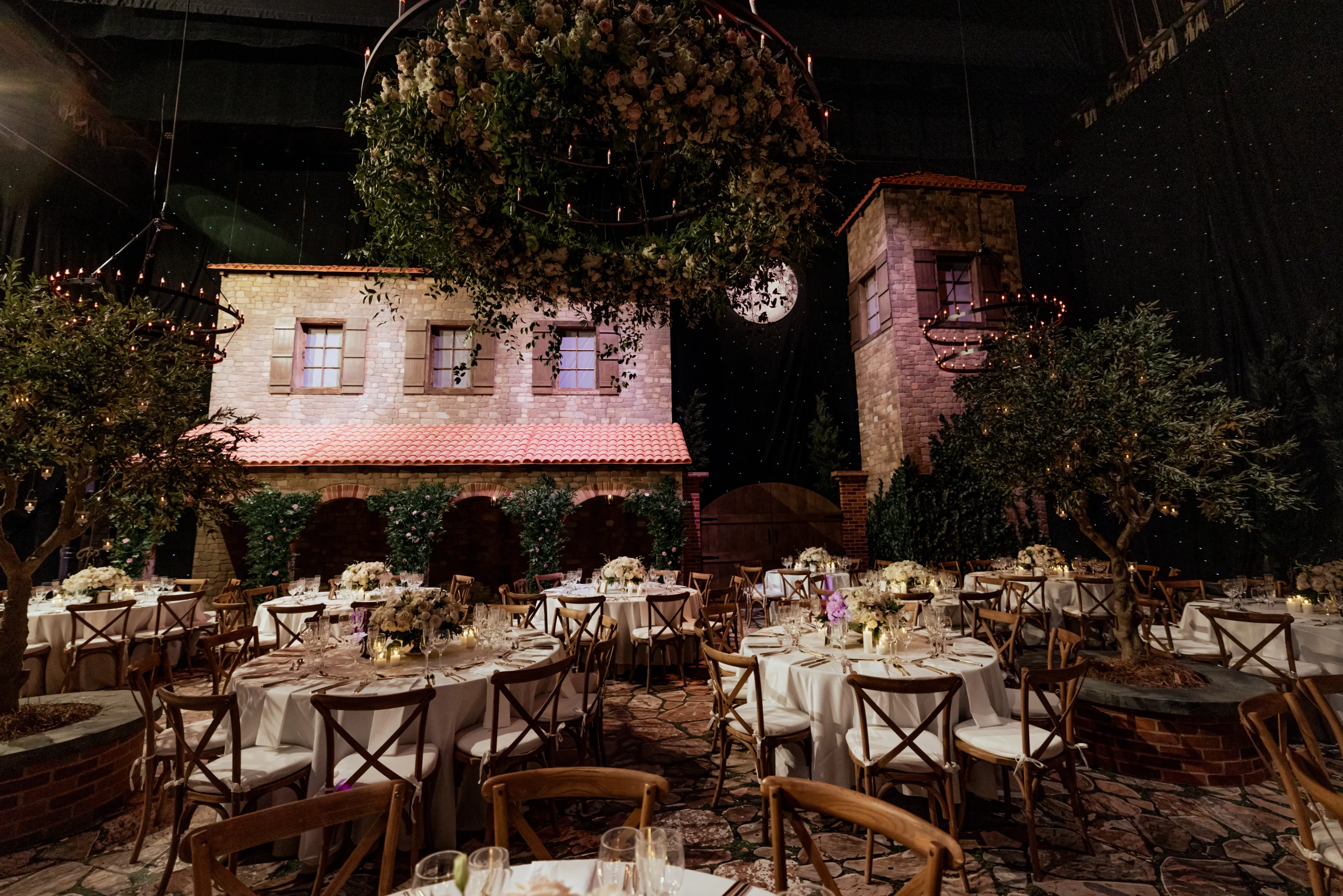 Tuscan villa themed dinner with full scenic facade build and olive trees — EventPro productions