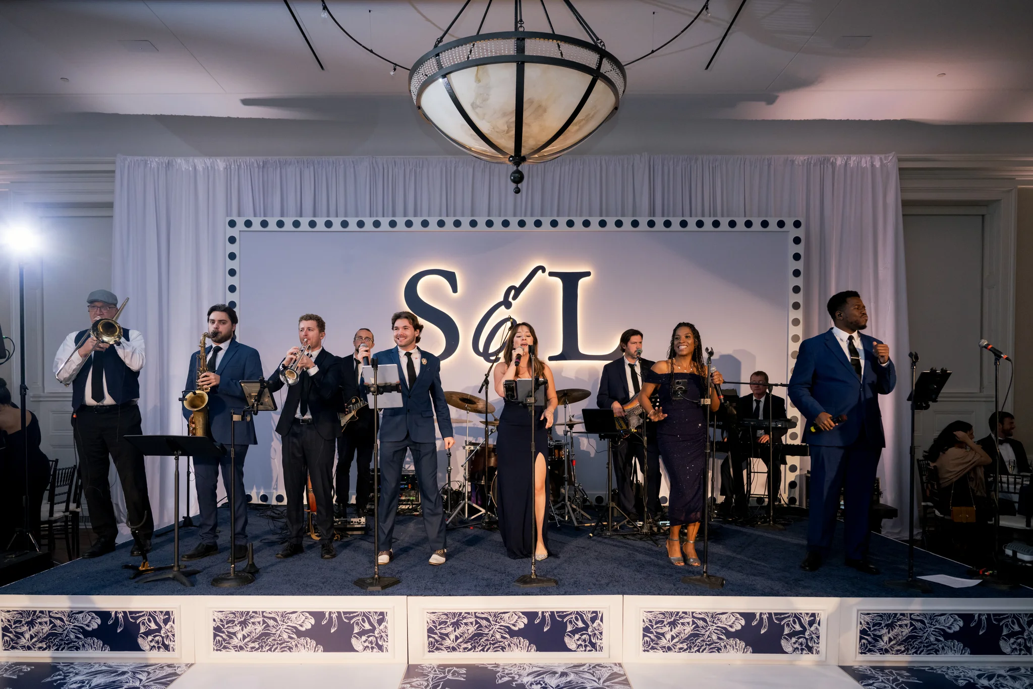 &ldquo;Something Blue&rdquo; wedding at Brittland Estates Maryland — live band performing on custom stage with LED-backlit CNC monogram backdrop, EventPro event production Maryland