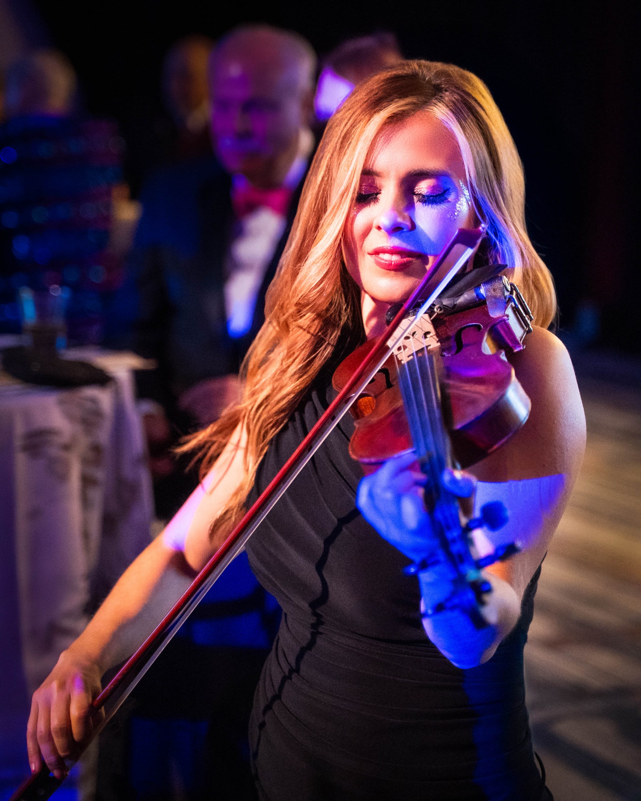 Violinist portrait, black dress, blue lighting, performing at the Wilmer Eye Institute Centennial Gala, Baltimore Marriott Waterfront, EventPro production