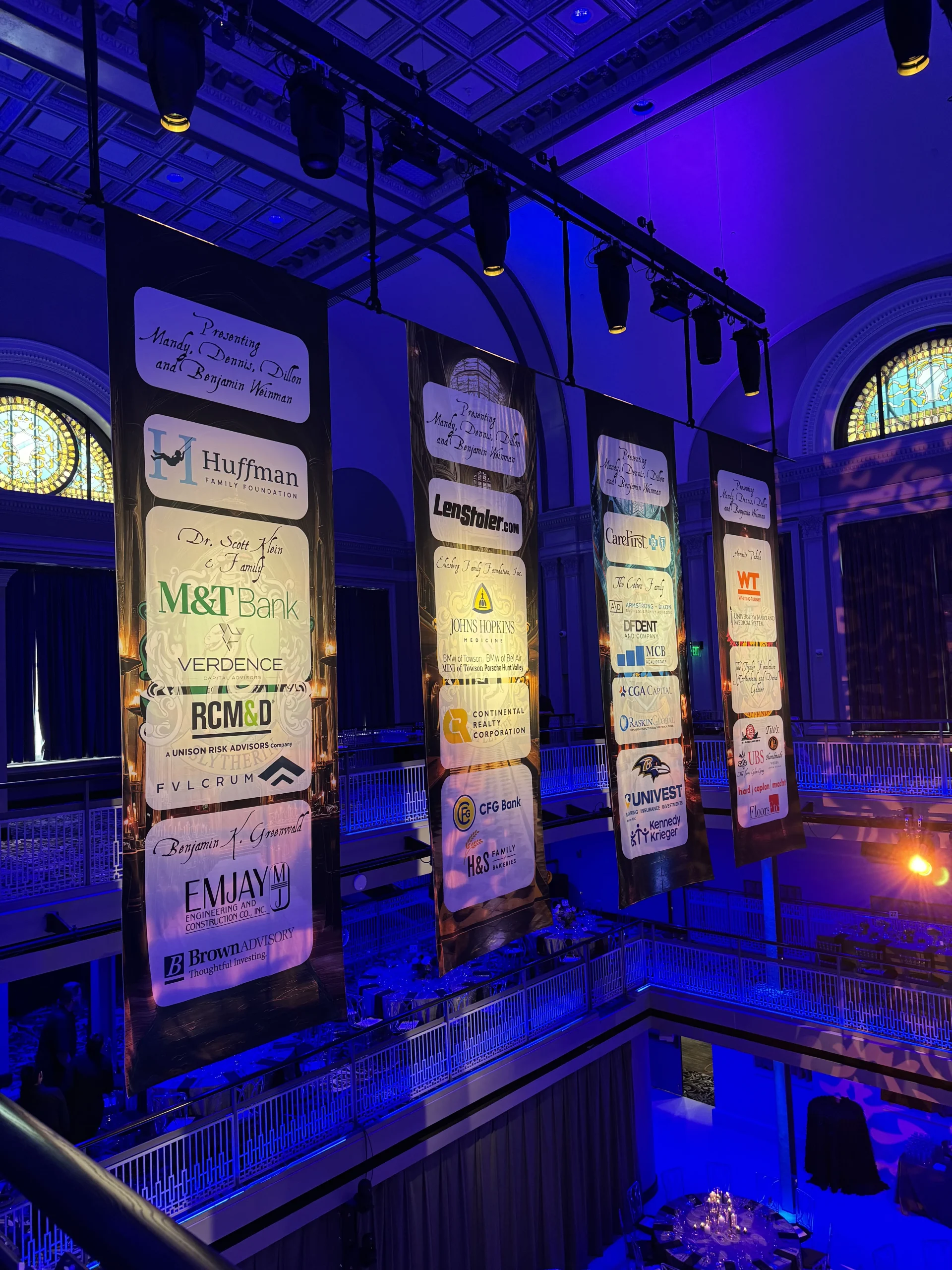 Illuminated hanging sponsor banner printed display at gala event produced by Event Pro